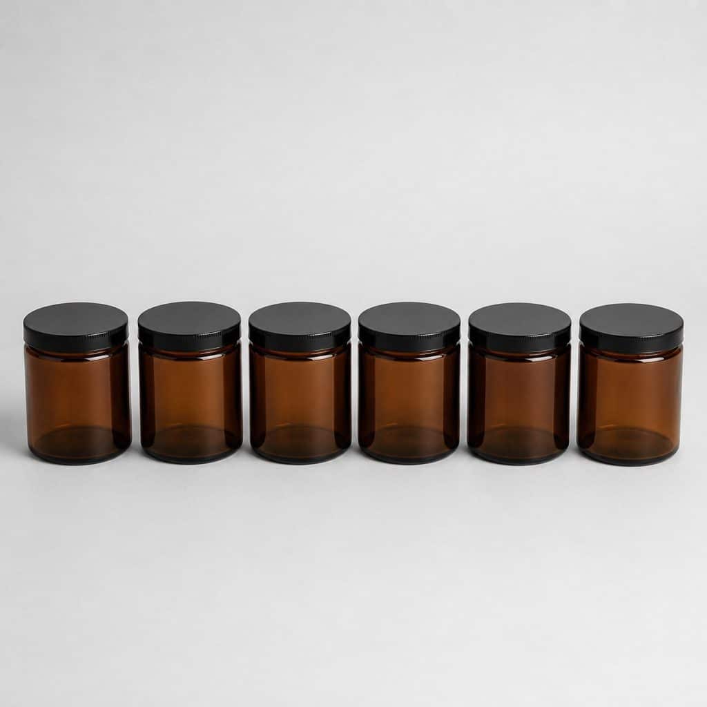 Six pots en verre teinté marron avec couvercle noir vissé