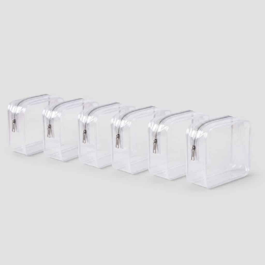 Kit de six trousses transparentes 20x20 cm pour un départ en famille