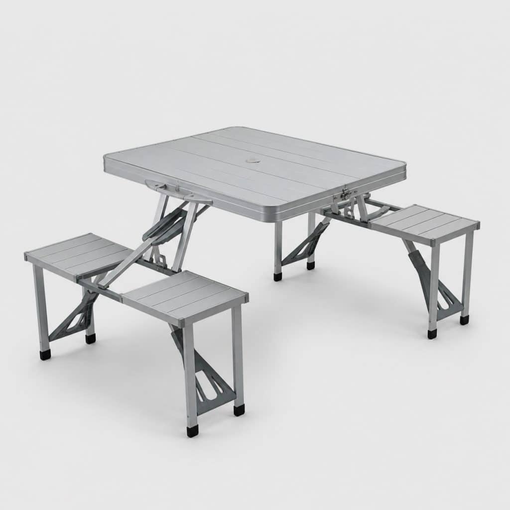 Ensemble table et 2 bancs pliants en aluminium léger, déplié sur l'herbe